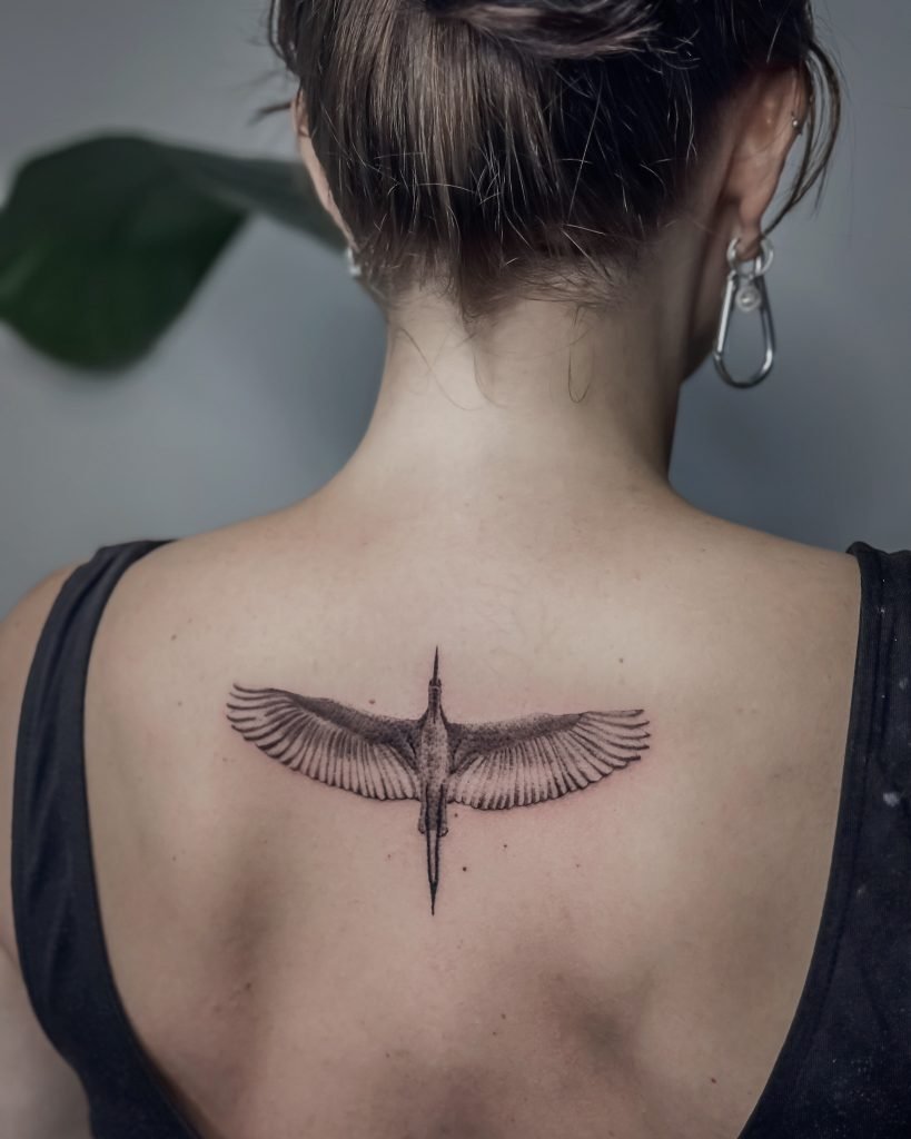 alex tattooing bird